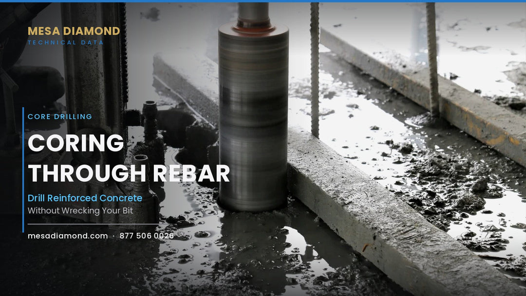 Core drill barrel cutting through a reinforced concrete beam
