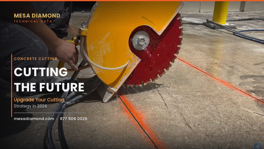 Operator wet-cutting concrete with a handheld diamond cut-off saw