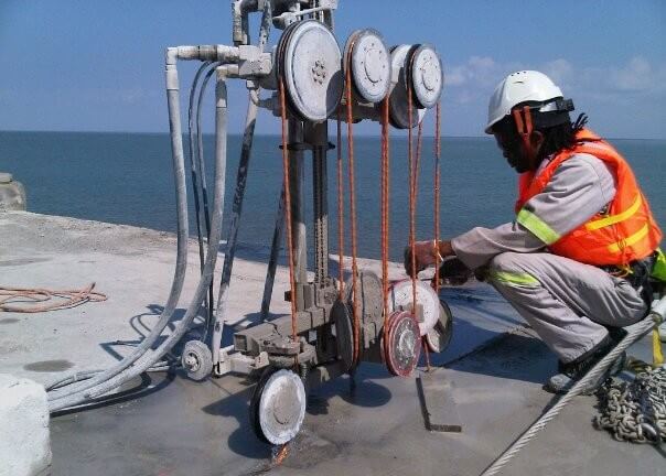 diamond wire cutting a person setting up wire sawing machine offshore diamond wire cutting